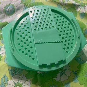 Vintage 1970 TUPPERWARE grater slicer lid and bowl.